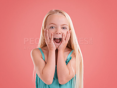 Buy stock photo Studio shot of a young girl posing on an orange background