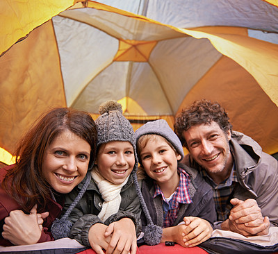 Buy stock photo Portrait, smile and family camping in tent on vacation, holiday or travel together. Face, parents and happy children at campsite with kids bonding to relax with mother and father on adventure trip