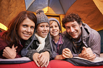 Buy stock photo Portrait, happy family and camping in tent on vacation, holiday or travel together. Face, parents and smile of children at campsite for kids bonding to relax with mother and father on adventure trip