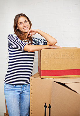 Buy stock photo Moving, boxes and portrait of woman in new home, estate or apartment for property. Happy, smile and confident young female person with cardboard package for equipment and products in modern house.