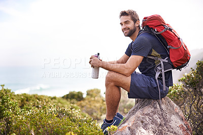 Buy stock photo Hiking, mountain and man rest on a rock thinking after exercise, workout and fitness in nature for wellness. Travel, vacation and male person or athlete smile at a view after training and trekking