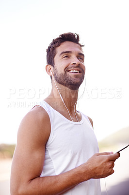 Buy stock photo Man, earphones and phone on road for running, music and motivation for cardio or training for marathon. Person, streaming and fitness on mountain for performance, athlete and playlist for exercise