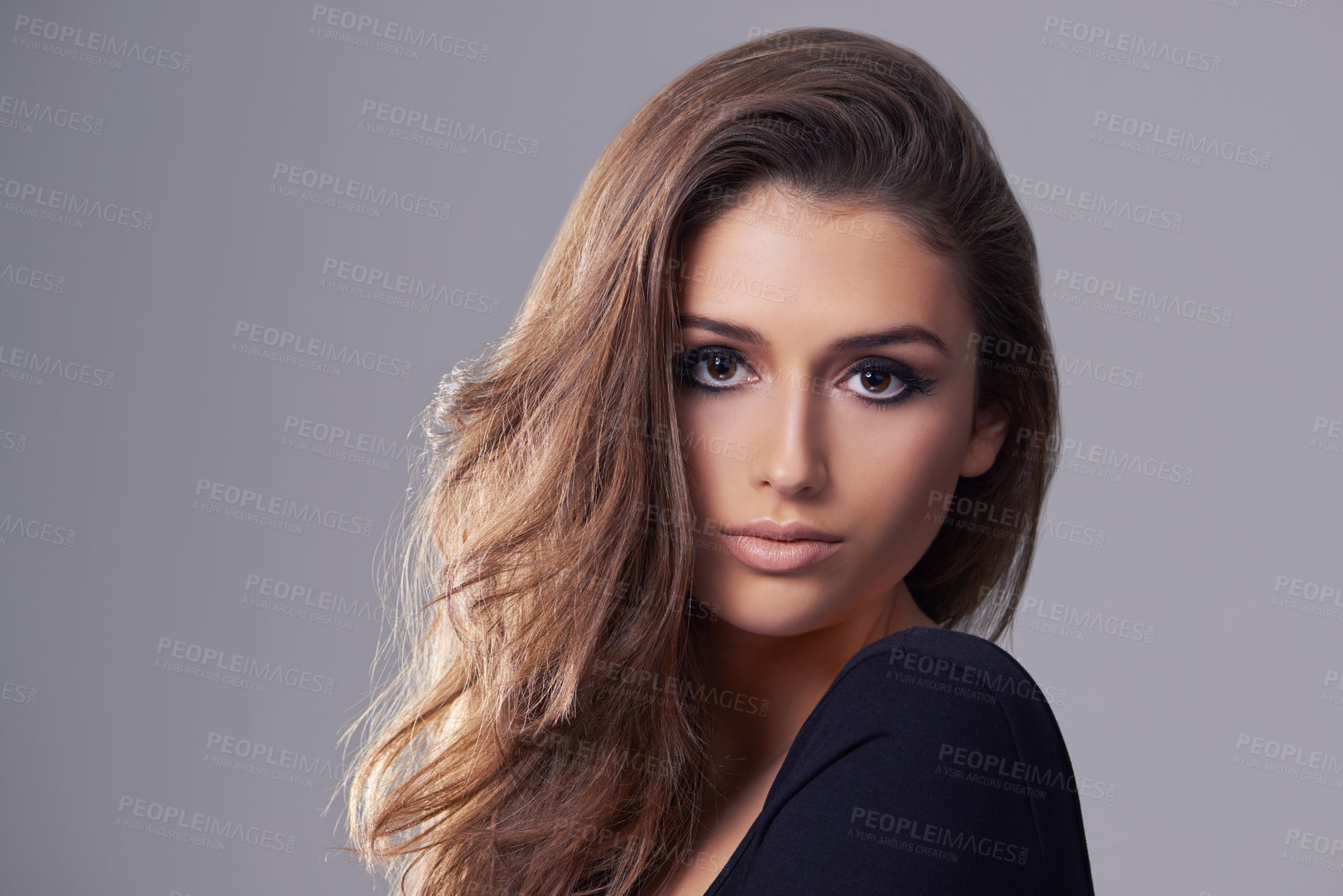 Buy stock photo Hair, model and portrait in studio for salon, treatment and glow on isolated grey background. Shampoo, confident and face of female person with natural cosmetics, hairstyle and volume in mockup space