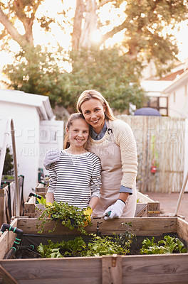 Buy stock photo Mother, daughter and gardening with portrait in home for bonding, happy family and organic hobby. Woman, girl child and smile with sustainability, agriculture and plant growth in backyard of house