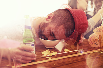 Buy stock photo Party, drunk and man sleeping with beer and unconscious face in bowl at bar counter for new year celebration. Tired, alcohol and exhausted black guy asleep holding drink at casual festive event.