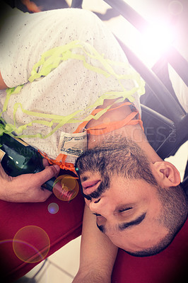 Buy stock photo Party, drunk and alcohol with a man sleeping on the floor after a new year celebration or event closeup. Beer, social and tired with a male asleep in a house or home with a bottle after a birthday