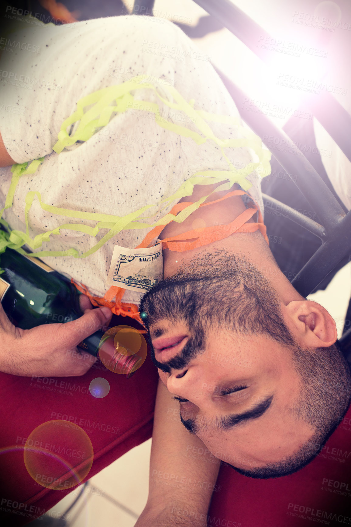 Buy stock photo Party, drunk and alcohol with a man sleeping on the floor after a new year celebration or event closeup. Beer, social and tired with a male asleep in a house or home with a bottle after a birthday
