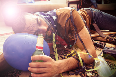 Buy stock photo Drunk, sleeping and man after a alcohol, celebration and party tired with a beer bottle. Person with hangover sleep with a drink wearing a USA flag after Independence Day social celebrate event