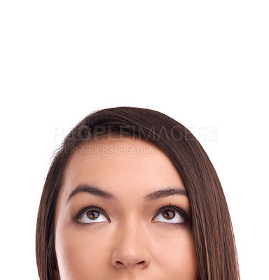 Buy stock photo Half face of a woman looking at mockup space in a studio for product placement or marketing. Beauty, young and female model a with empty mock up for advertising isolated by a white background.