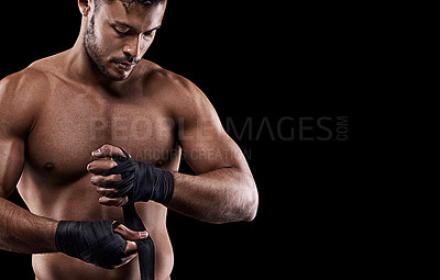 Buy stock photo Boxing, man and hand wrap in studio with getting ready to fight, exercise or training on mockup space. Athlete, boxer and martial arts workout for competition, wellness or topless on black background