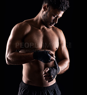 Buy stock photo Studio shot of a young boxer isolated on black