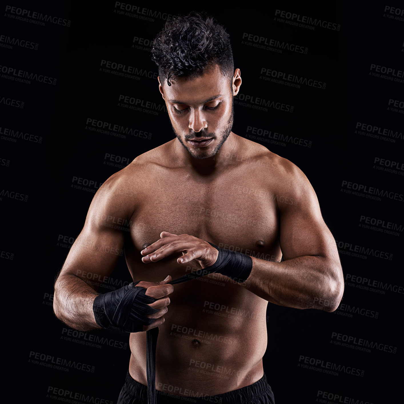 Buy stock photo Studio shot of a young boxer isolated on black