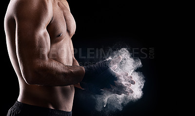 Buy stock photo Powder, male boxer and hands in studio, dark and muscles for fitness isolated on black background. Chalk, dust, combat sports and exercise for man athlete, MMA and boxing for training or competition