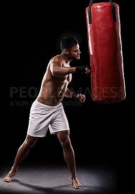 Buy stock photo Boxing, man and training in studio with punching bag for workout, exercise or competition fight with fitness. Athlete, boxer and confidence for martial arts with energy or topless on black background