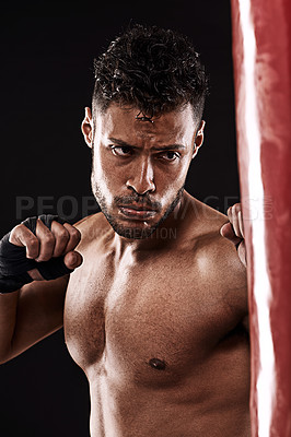 Buy stock photo Boxing, man and training in studio with fitness for workout, exercise or competition fight with punching bag. Athlete, boxer and confidence for martial arts with energy or topless on black background