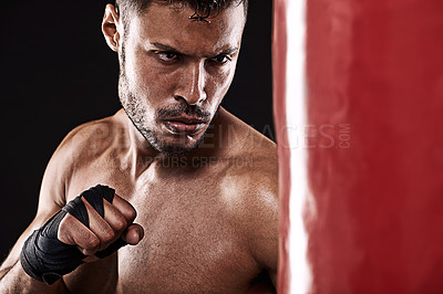 Buy stock photo Boxing, man or serious in studio with punching bag for training, exercise or competition fight with fitness. Athlete, boxer or workout for martial arts with performance or topless on black background
