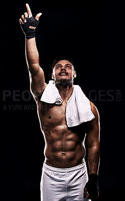 Buy stock photo Man, boxer and hand in studio for faith, fitness and pointing up for training on black background. Person, athlete and strong muscles for workout or exercise, religion and battle or competition