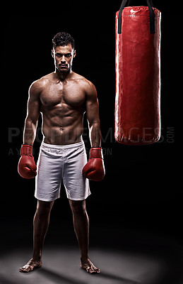 Buy stock photo Serious, boxer and portrait of man in black background with gloves for training with strength and muscle. Adult, athlete and male person in studio, healthy and power with body, punching bag and sport