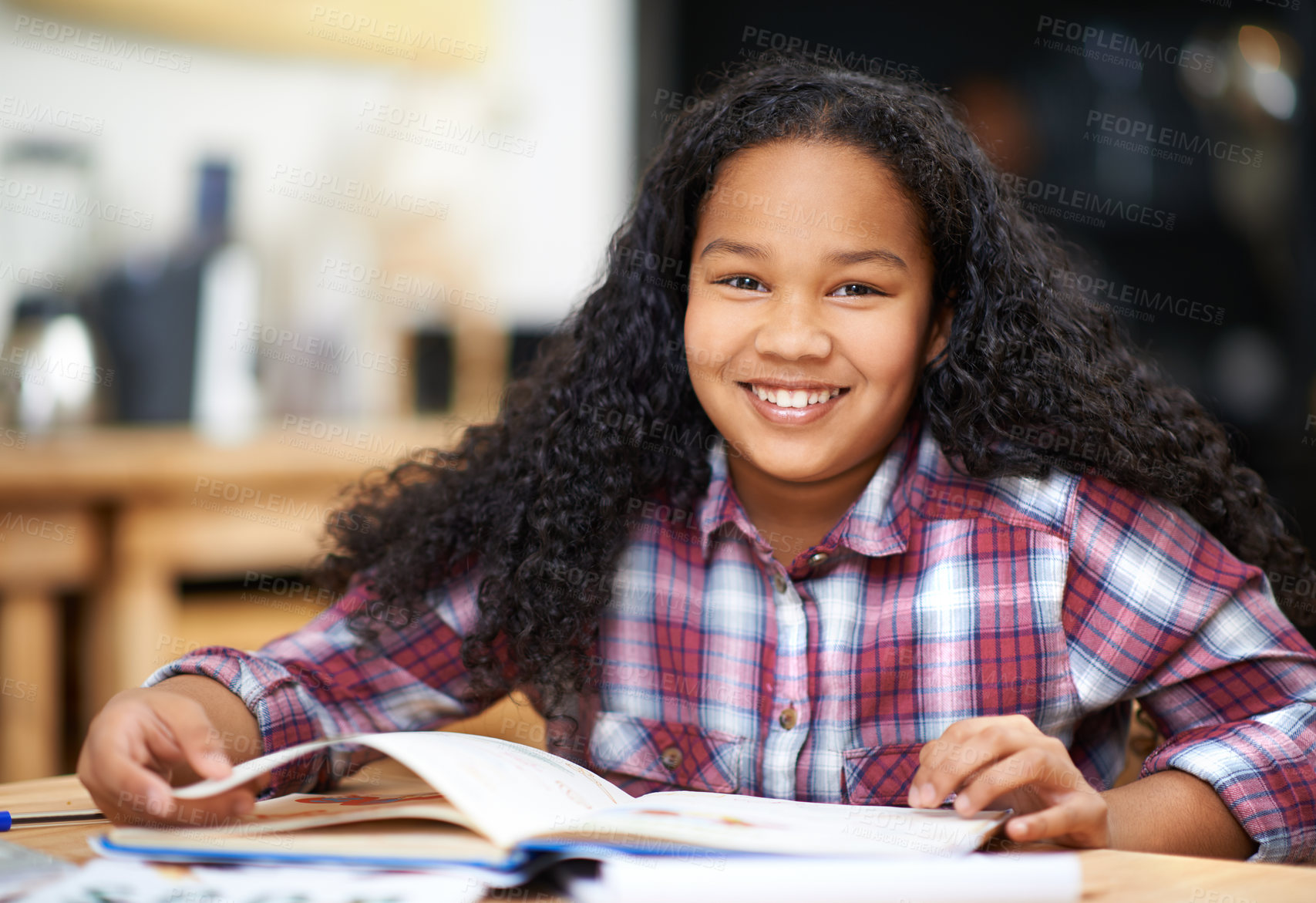 Buy stock photo Portrait of a young firl studying at a desk in a classroom