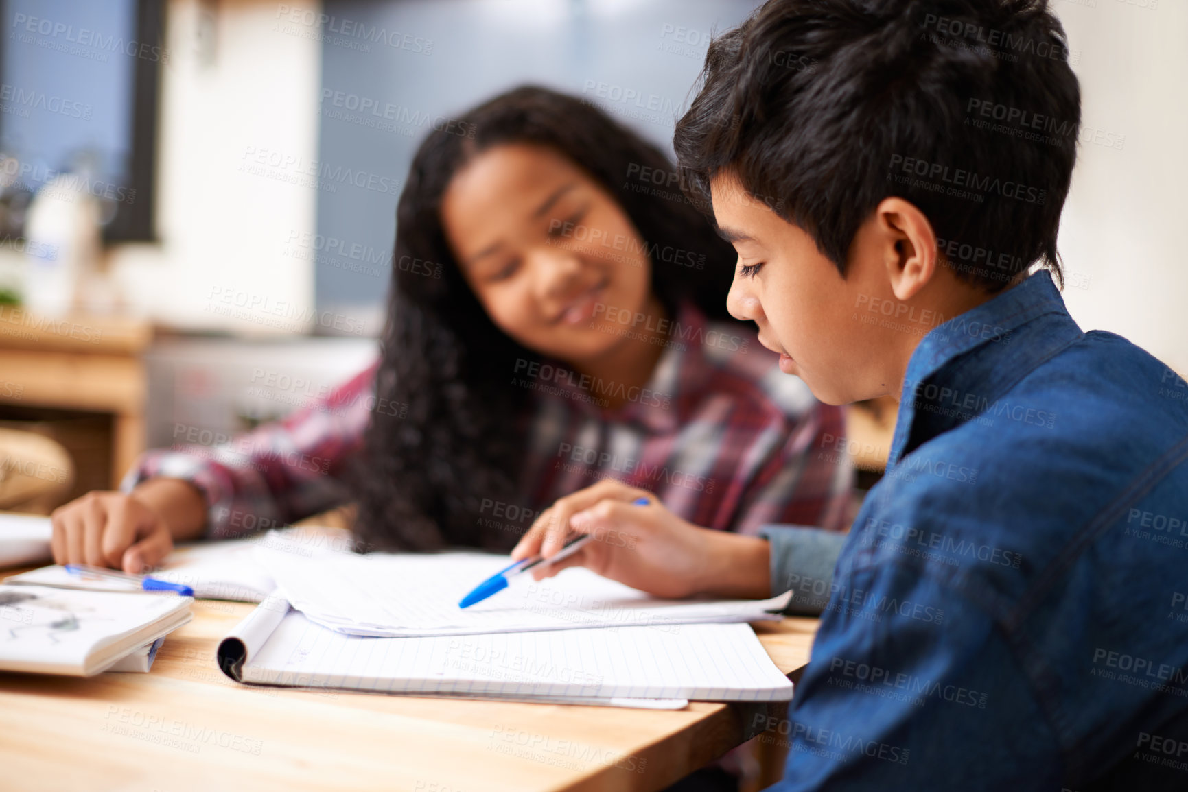 Buy stock photo Children, boy and reading in home for education with studying, learning and homework assessment by table. Friends, teenager and girl with books for knowledge, homeschooling and happy in dining room