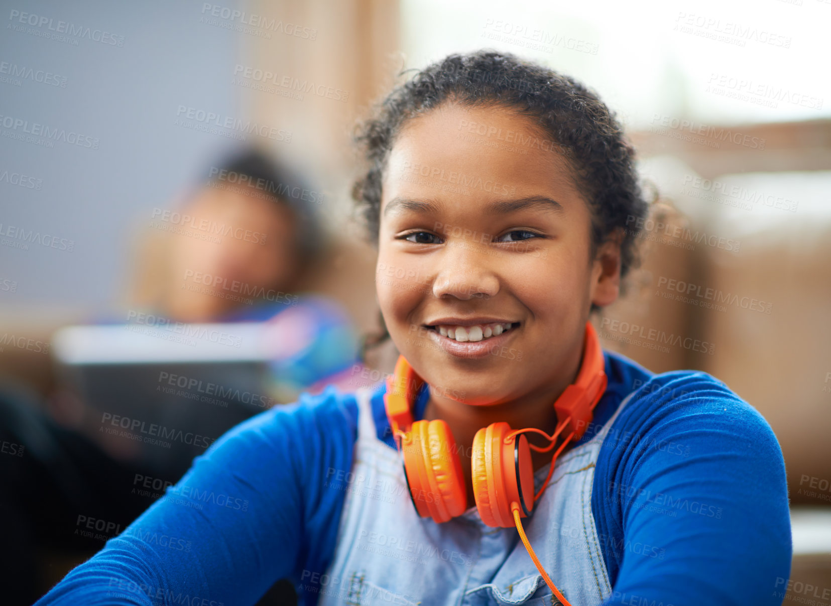 Buy stock photo Portrait of a little girl listening to music with her brother in the background