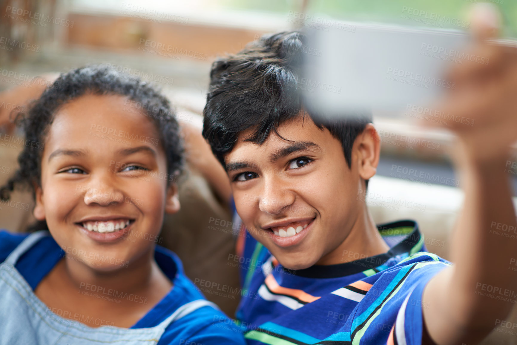 Buy stock photo Cropped shot of a little brother and sister taking a selfie