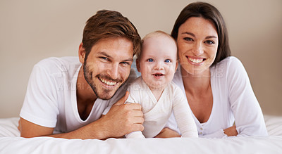 Buy stock photo Happy portrait, dad and mom of baby kid on bed for love, care and quality time together to relax at home. Smile of family, parents and cute newborn child for development, caring support and happiness