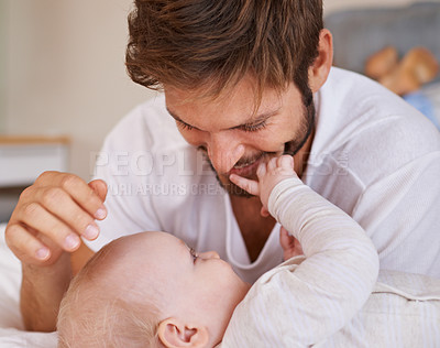 Buy stock photo Happy, love and baby with father on bed relaxing, playing and bonding together at home. Smile, sweet and young dad laying with girl child, infant or kid in bedroom or nursery at family house.