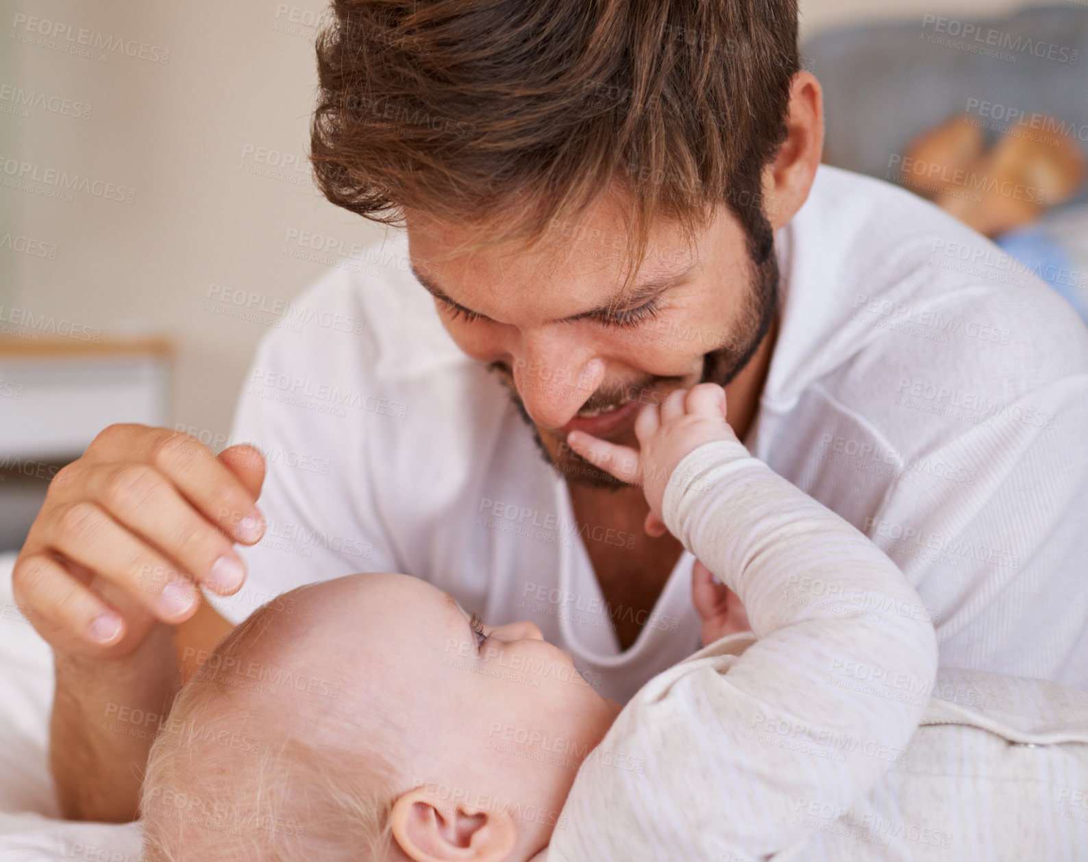 Buy stock photo Happy, love and baby with father on bed relaxing, playing and bonding together at home. Smile, sweet and young dad laying with girl child, infant or kid in bedroom or nursery at family house.