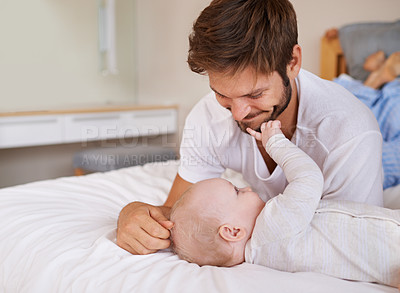 Buy stock photo Happy, bonding and baby with father on bed relaxing, playing and resting together at home. Smile, love and young dad laying with girl child, infant or kid in bedroom or nursery at family house.