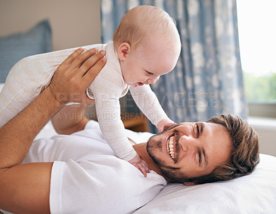 Buy stock photo Father, laughing and baby girl on bed for bonding, love and playing together in bedroom. Happiness, playful man and daughter for childhood development, parenting and morning fun in apartment