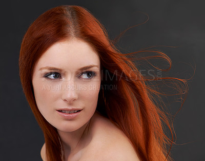 Buy stock photo Hair care, red and woman with shine, beauty and treatment with beauty on a dark studio background. Luxury, person and model with confidence and grooming routine with growth or cosmetics with wellness