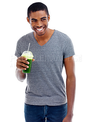 Buy stock photo Studio shot of a handsome young man enjoying a fruit smoothie