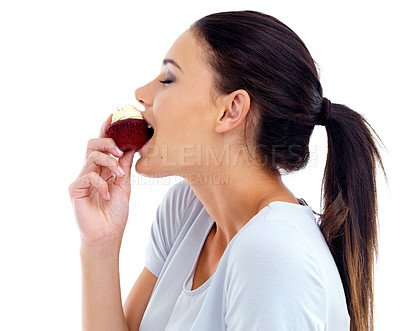 Buy stock photo Studio, woman and red velvet cupcake with eating for nutrition, happiness and unhealthy diet. Female person, food and sweet dessert with cake, snack enjoyment and tasty treat on white background