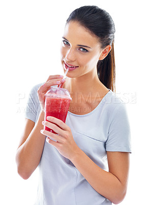 Buy stock photo Studio shot of a beautiful young woman enjoying a fruit smoothie