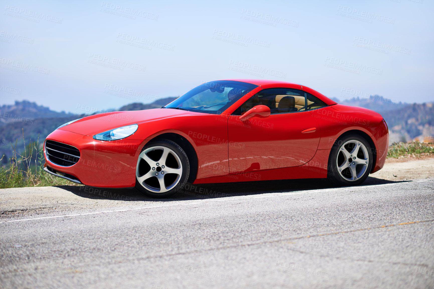 Buy stock photo Shot of a young woman driving in a sports car