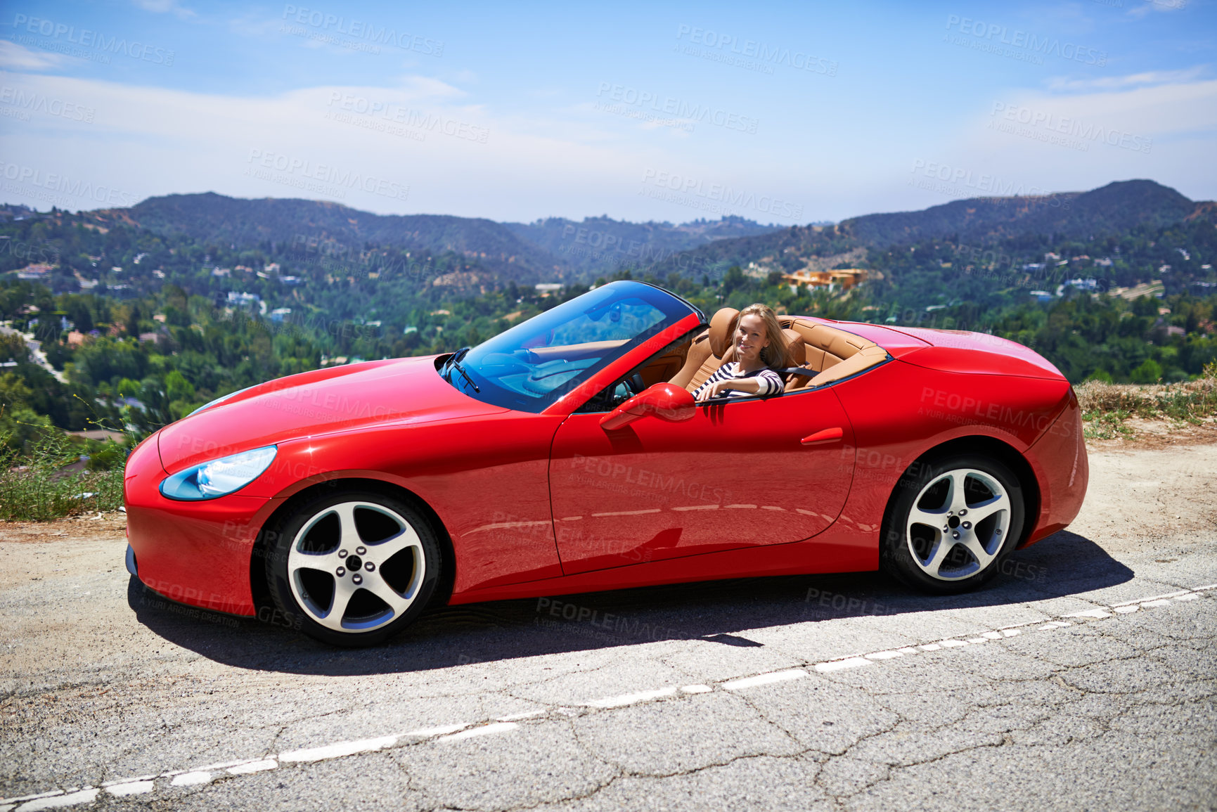 Buy stock photo Convertible, car and woman on a drive in city, outdoor in summer with happiness on road trip. Luxury, transport and portrait of female driver to travel on highway hill with red vehicle on street