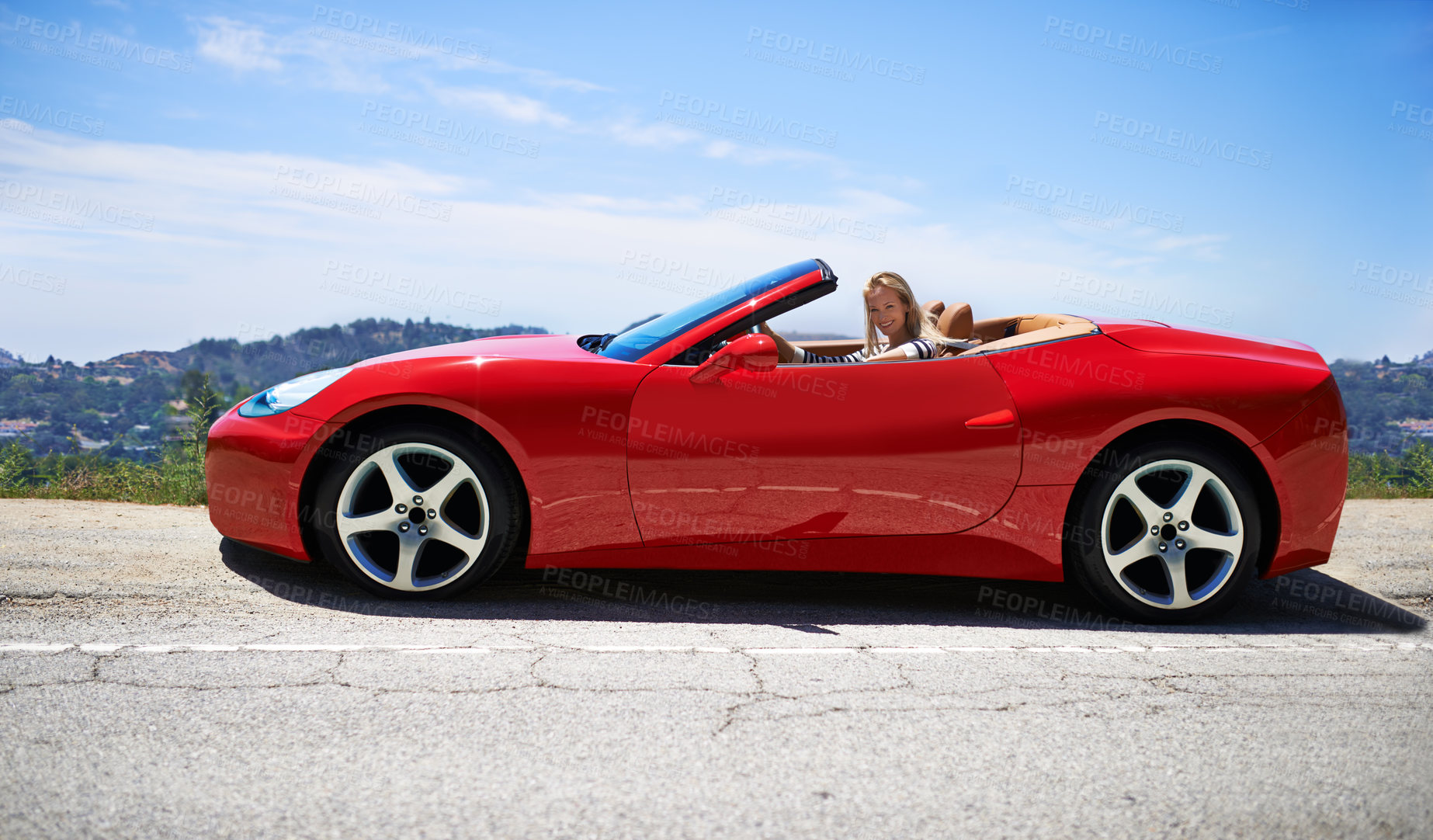 Buy stock photo Woman, red sports car and road trip on mountain, travel and luxury transport on summer drive. Female person, holiday and countryside wellness on street, relaxing vacation and adventure in vehicle