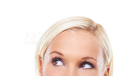 Buy stock photo Closeup studio shot of an attractive young woman looking up at copyspace