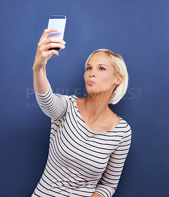 Buy stock photo Woman, pout or selfie as digital, memory or social media in viral, update or post on internet app. Confident, proud or influencer in fun, creative or online vision of connectivity on blue background