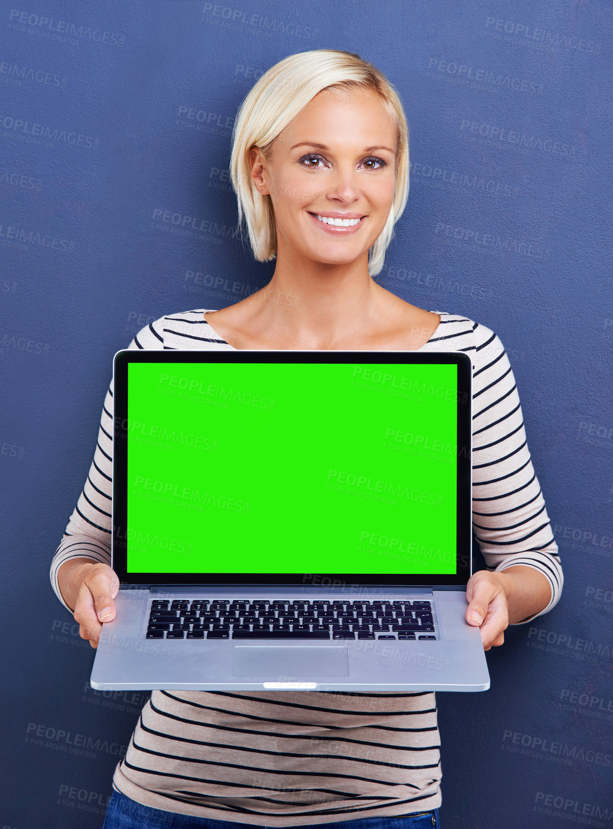 Buy stock photo Portrait, green screen and woman with a laptop, smile and internet on a blue studio background. Face, person and mockup space with model and computer with connection and promotion with website info