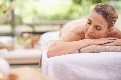 Buy stock photo Woman, massage or relax in luxury, wellness or holistic as peace, beauty therapy or self care. Spa, table or rest in zen, detox or balance at cosmetology, clinic or bodycare retreat in holiday resort