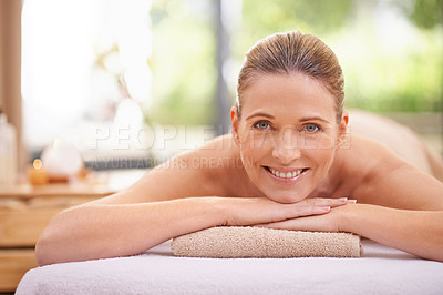 Buy stock photo Portrait, girl or wellness in luxury, massage or spa as peace, self care or beauty therapy. Natural, smile or woman on table, towel or detox as balance, cosmetology or bodycare in zen retreat