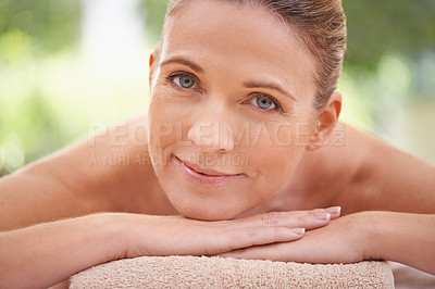 Buy stock photo Closeup, portrait or woman in skincare, beauty or glow of flawless skin, spa or peace in wellness. Girl, smile or lying on massage, table or towel in mental health, cosmetology or self care at clinic