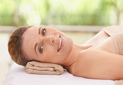 Buy stock photo Woman, face and smile at spa, massage and wellness with calm for zen and self care. Cosmetics, beauty and facial, relax and peace at luxury resort with treatment for stress relief and portrait