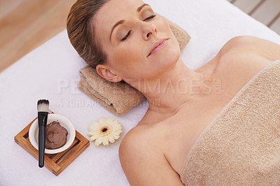 Buy stock photo Woman, face and top view for facial at spa, massage and wellness with calm for zen and self care. Cosmetics, beauty and brush with paste for mask, relax and peace at luxury resort with treatment