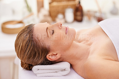 Buy stock photo Calm woman, sleeping and relax with towel for spa, zen or treatment on massage table, hotel or outdoor resort. Face of young female person asleep for peace, relaxation or accommodation in wellness