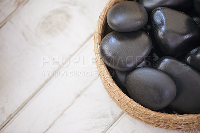 Buy stock photo Closeup shot of warm stones waiting to be used for a massage