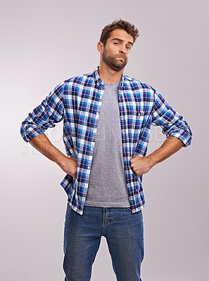 Buy stock photo Portrait, doubt and man in studio for fashion with jeans or shirt isolated on gray background. Serious person, attitude or unsure in casual clothes for judgement or uncertain on backdrop in Australia