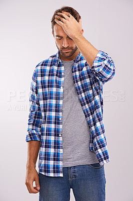 Buy stock photo Man, hand and headache pain in studio or fatigue stress on white background for migraine, burnout or mockup space. Male person, anxiety and brain fog tension with vertigo health, wellness or dizzy